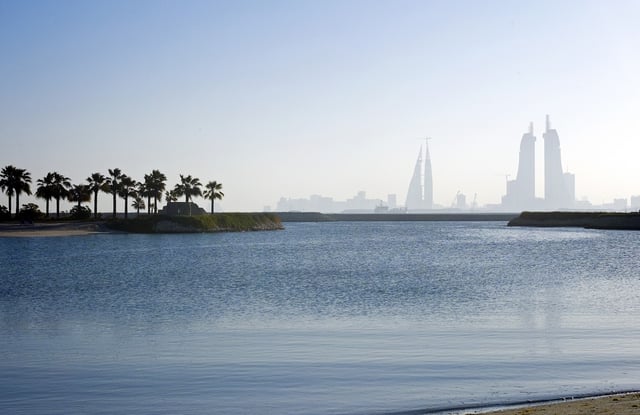 Calm Bahrain shoreline facing Manama buildings