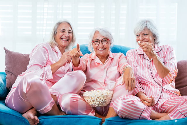 Smiling Retired Women Having Fun Indoors